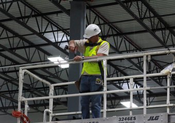 installing conduit to hang warehouse location signs