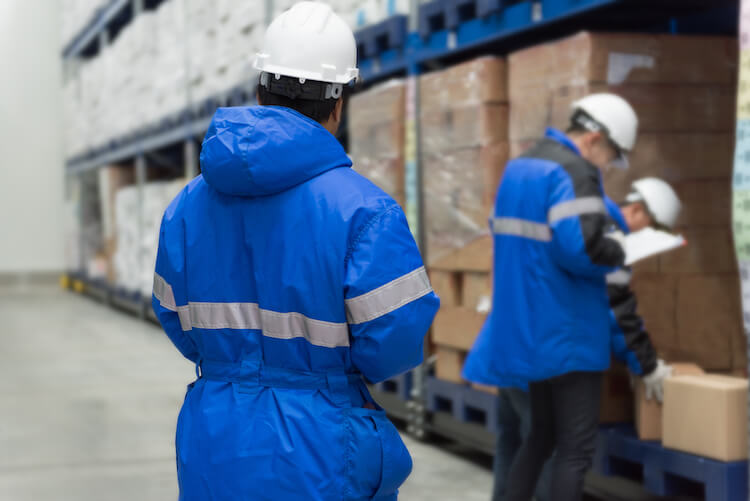 workers in a warehouse freezer