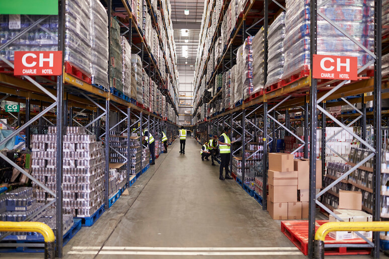 An aisle between storage units in a distribution warehouse