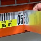 Applying warehouse rack label cover up solution