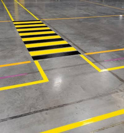 Warehouse floor striped pedestrian path