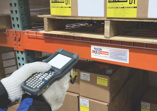 Cold storage warehouse worker scanning rack label