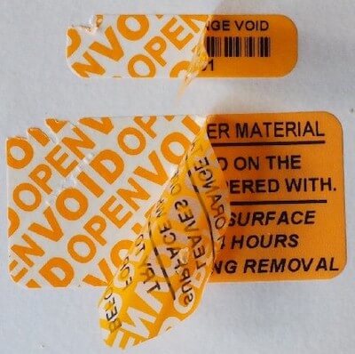 Tamper-evident calibration label with void background