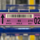 close up of warehouse magnet label on new racking